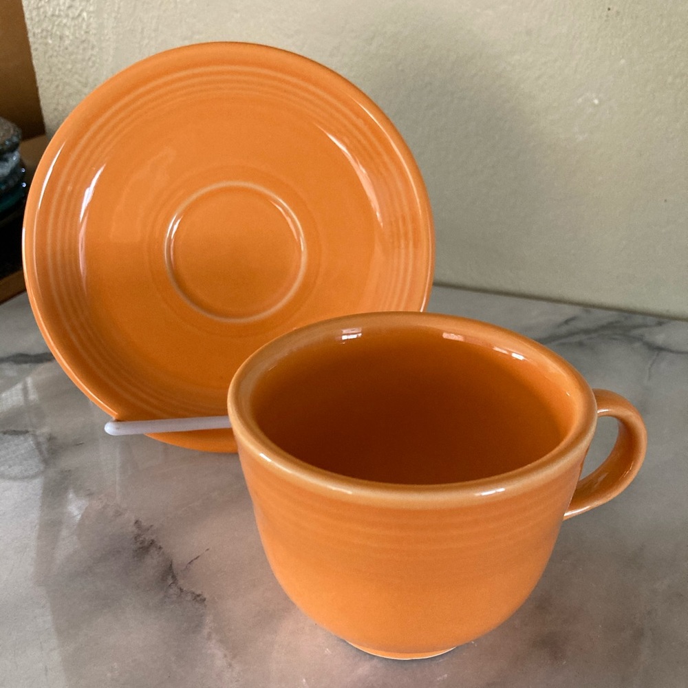 Tangerine Fiesta tea cup and saucer